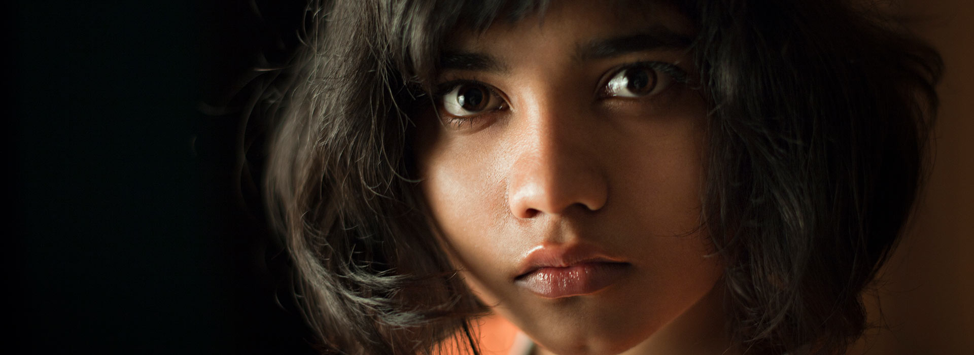 Serious young girl looking at camera