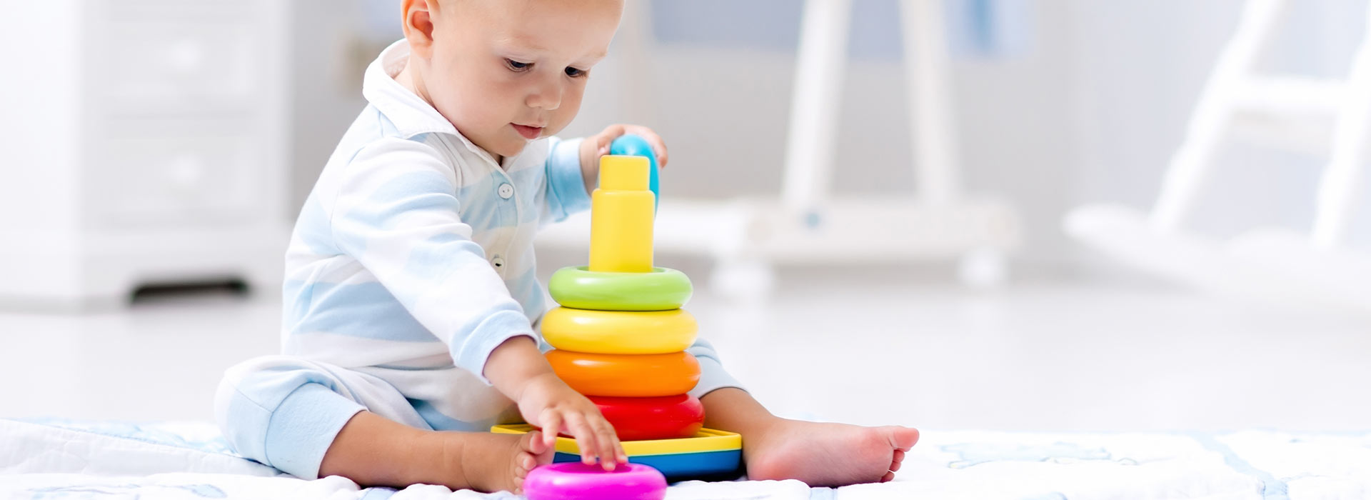 Baby playing with ring pyramid