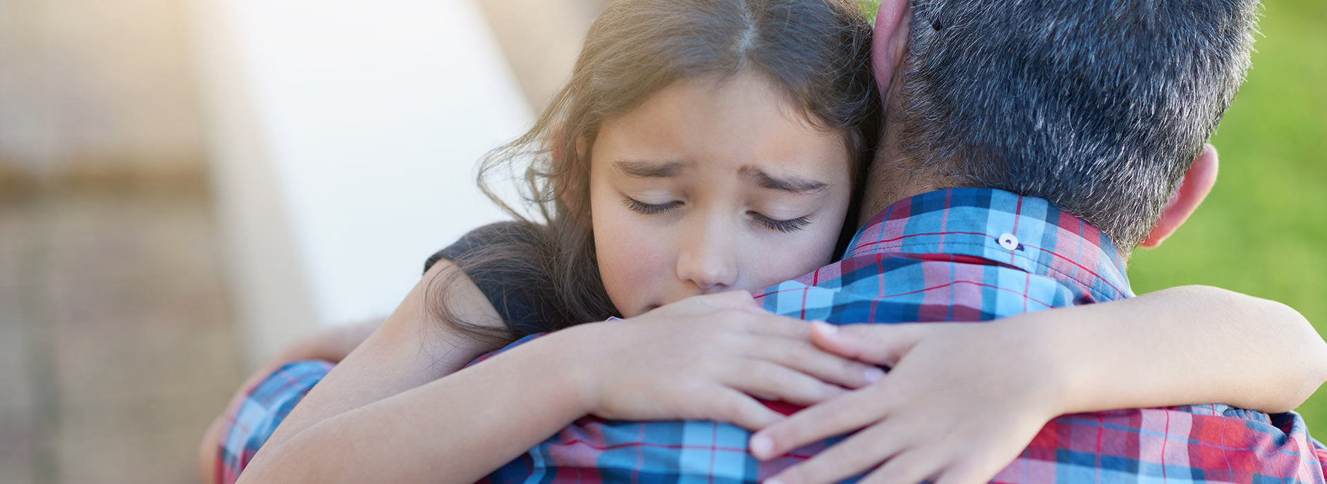 Child hugging parent