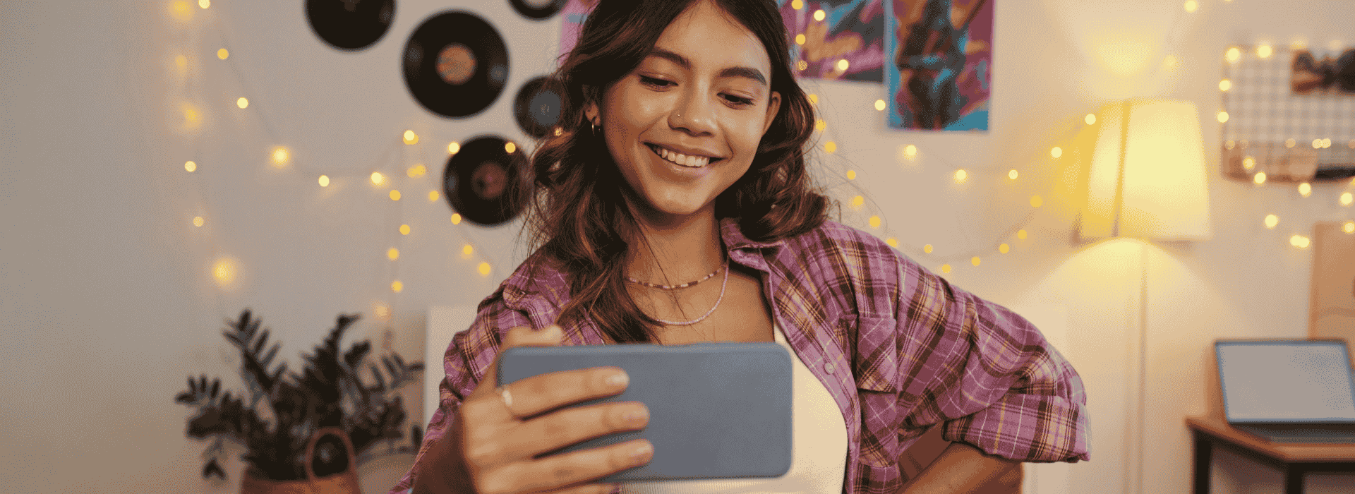 Teen Girl poses for a selfie with her phone