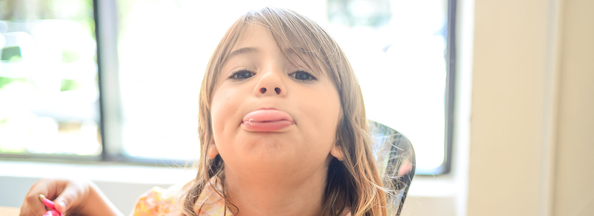 Young girl poking her tongue out