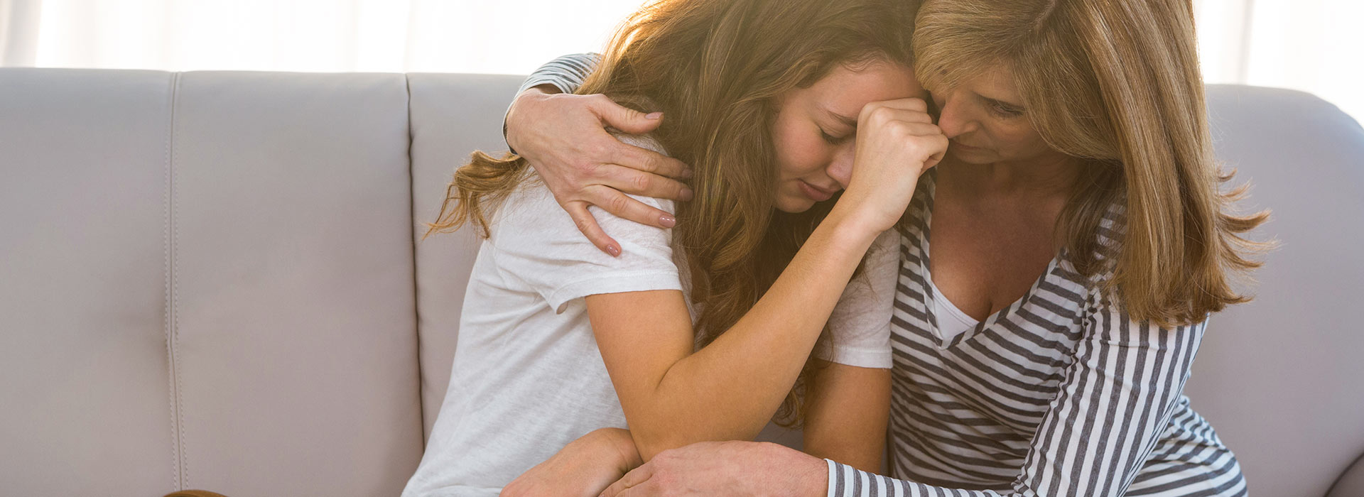 Mum hugs upset daughter